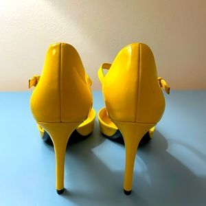 Women’s yellow shoes by Calvin Klein